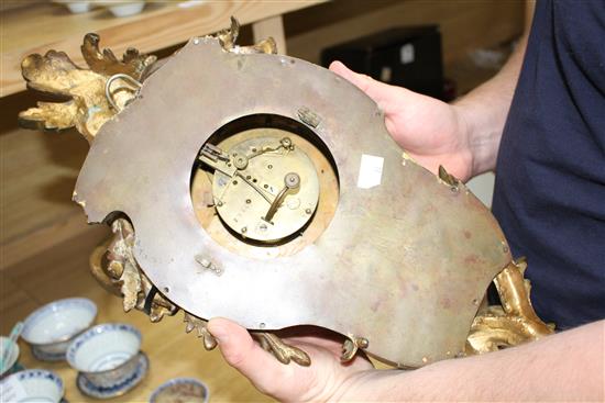 A 19th century French ormolu cartel clock, with enamelled Roman dial, overall height 49cm